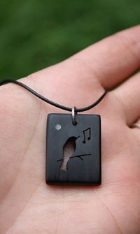 "This beautiful and unique hand-carved Song bird necklace will be made for you, or a loved one, in my studio on the West of Ireland. Adorned with a piece of mother of pearl inlaid, this delicate bird necklace features a piece of ebony wood, recycled from the fingerboard of a guitar, constructed by a local luthier. As a musician myself, I take enormous satisfaction in creating a necklace whose inherent wood has previously featured in a beautiful hand-made guitar. Also, part of ebony's attractiven