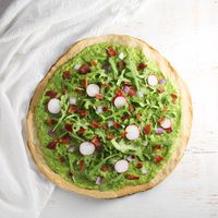 Grain, egg and dairy free flatbread topped with a creamy avocado pesto (nut-free!)! AIP & paleo!