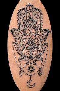 Black linework hamsa with ornamental foreground and mandala style details