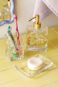 Your essentials have never looked better when paired with our Flora Soap Dish. Made from glass with an allover floral motif, this soap dish is perfect for keeping your space organized. Pair it with our other Flora favorites for a cohesive bathroom look. Available exclusively at Urban Outfitters. Features Flora Soap Dish from UO Home Allover floral motifs for a whimsical finish UO exclusive Content + Care Glass Wipe clean Imported Size Dimensions: 5.5" l x 3.5" w x 0.8" h Weight: 0.6 lbs | Flora