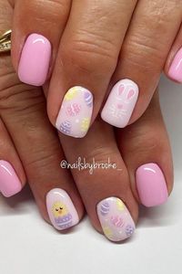 Get in the Easter mood with these adorable pastel pink squoval nails! 🌸🐣 Click through to see the charming chick, bunny, and multicolor Easter egg accents. Perfect for springtime celebrations! // Photo Credit: Instagram @nailsbybrooke___