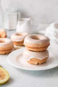 Soft cake-like lemon baked donuts topped with a sweet lemon glaze. These donuts are made fresh in the oven in just 35 minutes!