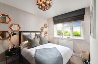 The mirrors create a perfect feature for this stunning bedroom at Princes Chase in Leatherhead