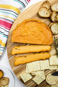 A Vegan Baked Smoky Cashew Cheese made with whole ingredients, smoked paprika, easy and simple methods for a tangy, cheesy and healthy baked cheese. It slices, it spreads and it is completely dairy-free and oil-free! #vegan #vegancheese #smoky #cashews #oilfree #veganrecipes via @thevegan8