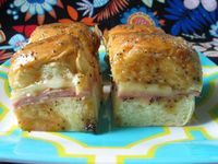 This recipe was given to by my friend, Kristin, who always has great party food. This is a variation of those baked ham and cheese appetizer sandwiches and these are always the first to go.