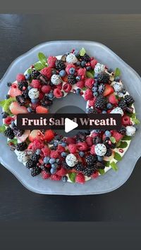 Pamela Salzman on Instagram: "This fruit salad wreath will be sure to wow everyone on Christmas morning and believe me, if I can do it, anyone can do it.  Prep all the fruit the day before and then it will only take minutes to assemble this.  You can use whatever fruit you like, but a mix of colors feels festive. Take a large round shallow platter and invert a bowl in the middle.  Spread a base of your favorite Greek yogurt (I lightly sweetened plain whole Greek yogurt) or a nice thick coconut yogurt on the bottom and layer your fresh mint and fruit.  My only mistake was burying the green kiwi slices.  I wish I could see more of that.  Remove the bowl and replace it with a bowl of granola if you like.  You can also do a dessert fruit salad on a base of whipped cream.  IB: @lizthedietitian 