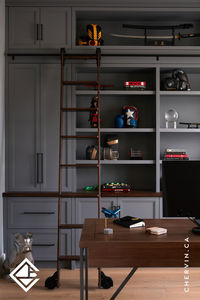 Discover the perfect blend of style and productivity in #ProjectFay's home study sanctuary! 🖤📁 The sleek grey cabinets, paired with edgy black hardware and a rich stained maple countertop, create an atmosphere of sophistication and functionality. The addition of a rolling ladder adds a charming touch, ensuring easy access to every inch of storage space. Elevate your home office with this inspiring design, where every detail is crafted for both style and efficiency. 
.
.
.
#ChervinKitchen #HomeOffice #HomeStudy #DreamHome #OfficeGoals #LuxuryHome #InteriorDesign #RollingLadder #Contemporary #WoodCountertop #DarkGreyCabinets #OfficeInspo