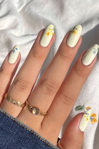 cottagecore florals 🌼
•
inspired by a sweater I got that’s covered in alllll these florals :)!! kinda just combining the best of all worlds in one mani? my obsession for hoodies + love for florals + nail polish of course lol. The contrast between complementary colors just works ya know? thumb nail is my favorite hands down :)!