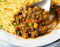 This Easy Sheperd's Pie recipe has a delicious ground beef filling with gravy and frozen vegetables. Prepare it on the Stove Top in less than 30 minutes, then broil for 5. This is a perfect shortcut dinner for busy weeknights and a great way to use up leftover mashed potatoes.