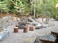 Hillside fire pit with large stones