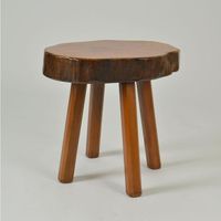 Pair of handcrafted side tables in Burr Elm wood 1970's. These stools have been handmade individually, therefore each stool is unique with a freeform shape seat using the natural contours of the wood. The voluptuous four legged tabless have a rustic alpine inspired style. These tables have acquired a nice patina commensurate with their age. Dimensions of individual tops are; 34 x 29 and 37 x 40 cm.