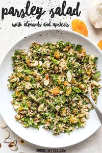 This Parsley Salad with Almonds and Apricots is savory, sweet, crunchy, and drenched in a tangy homemade vinaigrette! Holds up well to refrigeration and perfect for meal prep! Budgetbytes.com