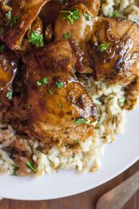 Creamy Balsamic Skillet Chicken - Rich, flavorful, boneless chicken thighs served over rice with a creamy balsamic sauce you'll love!