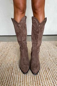 Our Blaze Western boots feature a cowboy design, embroidered detail, pointed toe, slip-on design, and block heel Faux suede