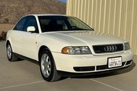 This 1998 Audi A4 1.8T Quattro was registered with one owner in California before it was acquired in 2023 by the selling dealer, who reports the vehicle had been in storage since 2010. Finished in Casablanca White over Opal Gray leatherette, it was optioned with the Sport Package that included seven-spoke 16″ wheels, a sport steering wheel, and sport-tuned suspension. It also has a sunroof and automatic climate control. Power comes from a turbocharged 1.8-liter inline-four that drives all fou...