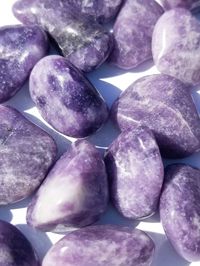 Lepidolite tumbles are considered healing stones for the third eye and crown chakras. It's known for increasing mental clarity and focus for meditation.  The healing properties of lepidolite include depression and emotional balance. Lepidolite also assists with transitioning behaviors.