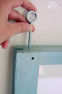 Pretty Handy Girl - hang old windows with an eye hook and ribbon or rope - via Remodelaholic