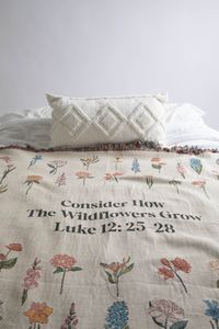 Our Consider How The Wildflowers Grow throw blanket is a perfect accent to any room. This beige white woven throw features minimal wildflower florals arranged as a meadow. The small and medium sizes (37x52 or 50x60) are perfect to use as a christian wall tapestry or to drape over a chair or couch. Larger sizes work wonderfully as an indoor blanket, picnic blanket, or a bedspread. Text Reads: Consider How The Wildflowers Grow - Luke 12:25-28 Content + Care- 100% Cotton- Machine Wash, Cold Cycle,