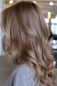 Dark blonde hair offers a versatile range of tones, from rich honey to subtle ash. Explore more ideas here.