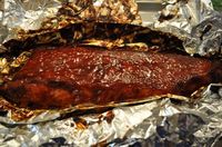 Ribs in the Oven (for those of us who can't cook outdoors year round!) This couldn't be simpler. One jar of your favorite BBQ sauce, a rack a ribs and foil is all you need.