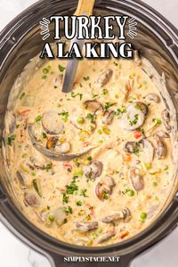 Turn your leftover Thanksgiving turkey into a comforting meal with this Slow Cooker Turkey a la King recipe. Just mix the turkey with peppers, mushrooms, and peas in a creamy sauce, then ladle it over biscuits for a family dinner that feels both special and satisfying.