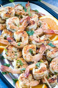 Fast, easy and delicious these Mojo Shrimp Kabobs are full of flavor, orange, lime and spices this is the perfect addition to your grilling game. #shrimp #kabobs #grilling #seafood #appetizer #maindish 