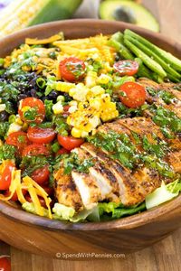 Southwest Salad is packed with our favorite flavors for the most delicious summertime meal! Perfectly seasoned grilled chicken, corn, avocado, beans, and romaine lettuce are all tossed together in a lime vinaigrette.  #spendwithpennies #chickensalad #grilledchicken #southwestchickensalad #texmex #texmexsalad