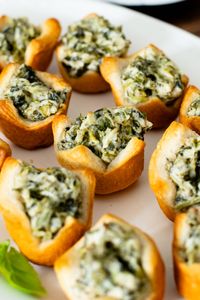 These Spinach Dip Crescent Bites are the perfect vegan holiday appetizer! Bite-sized and dairy-free, these are easy & tasty!