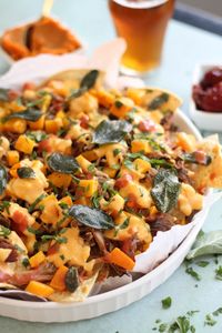 Pulled Pork Nachos with Pumpkin Chipotle Queso, Butternut Squash, and Crispy Sage