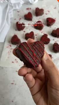 These are the perfect bite sized sweet treat for Valentine’s day!   RECIPE (makes 16 truffles)  INGREDIENTS  • 3 cups (390 g) Red velvet cake crumbs (left over or freshly baked, one cake layer is enough)(link for the recipe in profile!)  • 5-6 tbsp cream cheese frosting or more if needed  • 200 g (1 1/4 cup) dark chocolate (54%) or semi sweet or milk chocolate  • 2 tsp coconut oil, To make chocolate coating thin & smooth  • 3-4 tbsp white chocolate to drizzle on top  • 1-2 drops of red food gel colour  • Heart shape small cookie cutter  DIRECTIONS  1. Crumble the cake into very small pieces in a large bowl.  2. Gradually add cream cheese frosting and mix with a rubber spatula until the mixture is well combined. It should be moist and have dough like consistency but not too wet or greasy