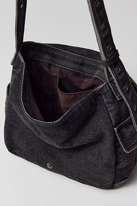 Essential messenger bag crafted from premium BDG denim. Low-profile silhouette with a pocketed flap closure. Lined interior with two pockets and plenty of space for your essentials. Complete with a zip pocket at the back for easy access, plus a water bottle pocket at the side. Finished with an adjustable strap - wear it on your shoulder or crossbody. Urban Outfitters exclusive. Features BDG denim messenger bag Washed soft denim with tons of storage Plenty of pockets inside and out Water bottle p