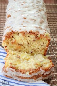 Dutch Apple Bread made from scratch with butter, sugar & fresh apples. Amazing flavor in this apple quick bread recipe topped with a cinnamon streusel & drizzled with warm vanilla glaze.