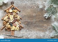 Christmas tree with dried fruits and nuts abstract background concept