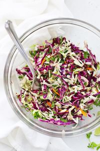 Cilantro Lime Slaw for Tacos, Burrito Bowls, and More! This Honey Lime Slaw tastes AMAZING on all things Tex-Mex. Taco Slaw // Slaw for Fish Tacos // Lime Slaw #tacos #slaw #fishtacos #sidedish #burritobowl #cabbage