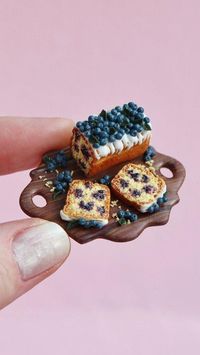 How about a blueberry loaf cake🫐😍I made a mini collection with blueberries - these are a variety of cupcakes and a pie. And also a teapot with a blue pattern, I published a tutorial on it earlier. In the next post I will show you a photo😍 As always, more detailed video on my YouTube channel. For the kitchen board I used our cutter, which can be ordered from SweetMiniDollHouse etsy ✨️ #handmade #polymerclay #polymerclayfood #fimo #fimocreations #fimoclay #cernit #miniature #miniatures #miniat...