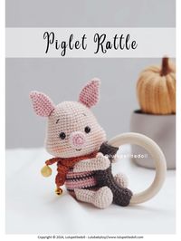 This document provides the pattern and instructions for making a piglet rattle toy. It includes materials needed, abbreviations used, and step-by-step instructions to crochet the head, ears, nose, body, legs, arms, scarf, and clamp for a wooden ring. Color changes and photos are included to illustrate the process. The finished toy can be assembled by sewing the parts together and attaching it to the wooden ring.