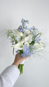 White & blue bridal bouquet Check more at https://beautyfashionideas.com/bridal/white-blue-bridal-bouquet/