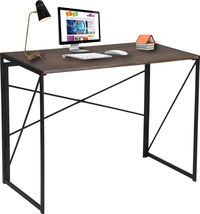 PRICES MAY VARY. [Save Space and Optimize Your Space]: Our small computer desk is perfect for those tight spaces in your home or office. Measuring at only 17.71"D x 35.43"W x 29.52"H when unfolded, it’s perfect for small home offices, corners of rooms, school dormitories, workspaces. [Durable Materials for Longevity]: The waterproof and deformation-proof MDF material is built to last. With a stylish brown textured desktop design, this foldable table is both durable and solid. [Convenient and Portable]: The foldable desk design means you can easily store it away when not in use, saving valuable space. Plus, it’s lightweight and easy to carry for those on-the-go moments, like picnics or outdoor work sessions. [Multiple Uses Across All Rooms]: This versatile table is perfect for any room in t