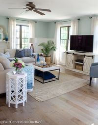 I am loving this modern farmhouse living room with coastal accents. The media console from HomeGoods is perfect! (sponsored) See how to install these Gorgeous Engineered Hardwood floors in Fairbanks Maple Dust.