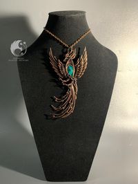 Blue Opalized Wood Pendant Carved Phoenix Bird with copper wire SIZE* Length            : 140 MM Wide               : 70 MM Thickness      : 13 MM WEIGHT         : 35 GR If you are still in doubt, please send a message directly to our store for more detailed information *IMPORTANT* PLEASE STATE YOUR CONTACT/ PHONE NUMBER IN THE "NOTES TO SELLER". WITHOUT PHONE WE ARE UNABLE TO SHIP YOUR ORDER. thank you very much from us INDONESIA MAJESTIC ARTWORK