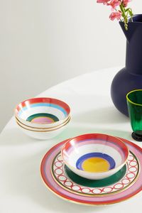 La DoubleJ's inviting gelato bowls are each painted with a kaleidoscope of rings - meant to evoke longing for summer vacations on the Italian coast. Designed as a set of four, they're made from smooth porcelain, hand-painted with gold-plated rims. They'll add a vibrant pop of color when alfresco dining.