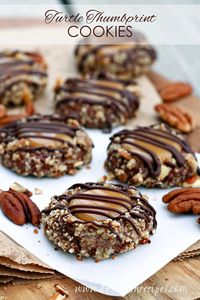 Turtle Thumbprint Cookies: Delightful chocolate nut thumbprint cookies with a caramel filling and chocolate drizzle.