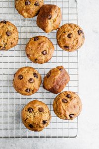 healthy banana muffins with chocolate chips on a wire rack