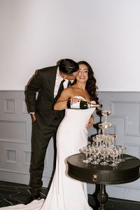 bride and groom, wedding, wedding reception, champagne tower, wedding champagne