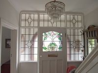 Through The Round Window: 1930s Stained Glass Door Panel with Contemporary Twist