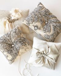 Marie Livet creates the most beautiful ring bearer pillows.