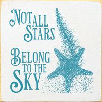 The Stars In The Sky Wall Art is a distressed old white wood piece with the phrase "Not All Stars Belong To The Sky" in soothing light blue, accompanied by a starfish drawing. Knotty pine 7"W x 7"H Dust with dry to damp cloth White and turquoise Made in the USA