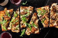 Mushroom flatbread is easy to make with store-bought flatbread and a few simple but flavorful toppings including an umami-packed miso-cream sauce and a blend of mozzarella and Parmesan cheese. Oven-roasted mushrooms quickly take the umami to the next level.