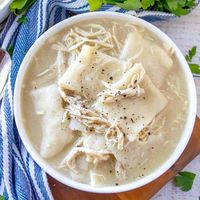 Old-Fashioned Chicken and Dumplings is a super simple recipe. Flat strips of dough simmered in a yummy broth with tender chicken.