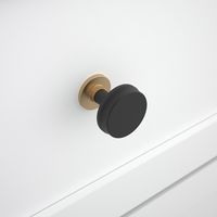 The Hilo Round Knob offers a casual, curated look for upgrading your home decor. The beautiful mixed metal finish makes the Hilo Round knob a striking statement for updating your home and coordinating with a variety of faucets, lighting, and bath hardware with an unforgettable style. This knob is offered in other finishes. Origin 21 Hilo 1-1/10-in Matte Black/Brushed Gold Round Cabinet Knob | CAB-000-437-MB-BG